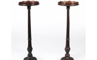 A pair of George III mahogany and chequer strung torchere stands