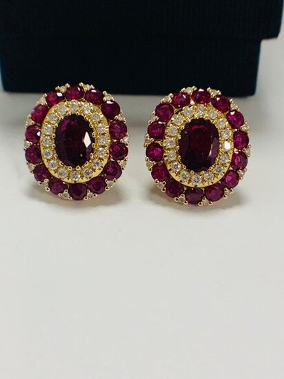 14ct Rose Gold Ruby and Diamond stud earrings featuring, 2 oval cut Rubies (1.47ct TSW), claw set, with 60 round cut Rubies (1.99ct TSW), claw set, and 60 round brilliant cut Diamonds (0.39ct TDW), claw set.
