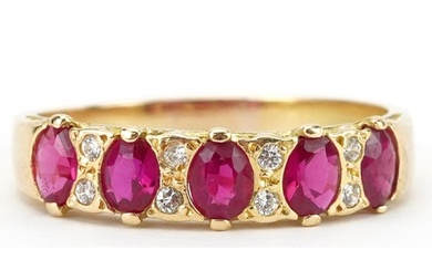 18K gold ruby and diamond half eternity ring set with five r...