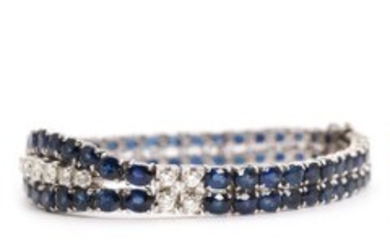 1918/1105 - Sapphire and diamond bracelet set with numerous faceted sapphires and brilliant-cut diamonds, mounted in 14k white gold. L. 18 cm. 1960's.