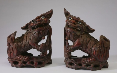 (2) Chinese carved hardwood Fu lions w/ glass eyes