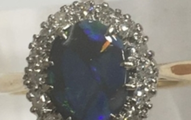Ring in 18 kt yellow gold and 950 platinum/natural diamonds and opal