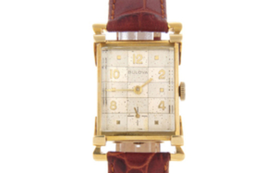 BULOVA - a mid-size yellow metal wrist watch with two Bulova wrist watches.