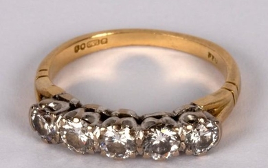 A diamond five-stone ring, claw set in white metal to
