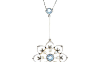 An Edwardian 15ct gold and platinum, aquamarine and seed pearl pendant, with chain.