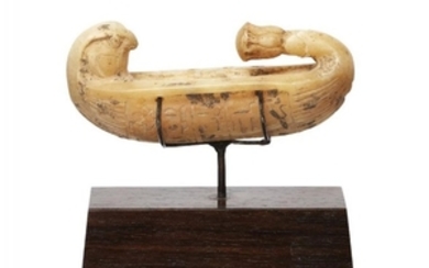 An Egyptian alabaster ritual boat with hieroglyphic...