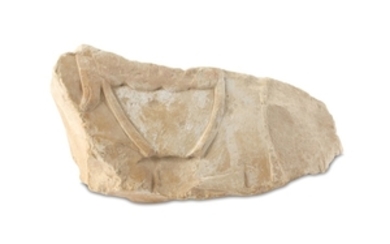AN EGYPTIAN LIMESTONE RELIEF FRAGMENT A small fragment...