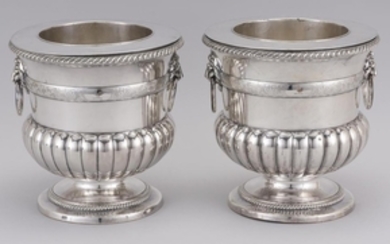 PAIR OF GEORGE III NEOCLASSICAL SHEFFIELD SILVER PLATED WINE COOLERS Registers of rooster armorials and shell and scrolling foliate...