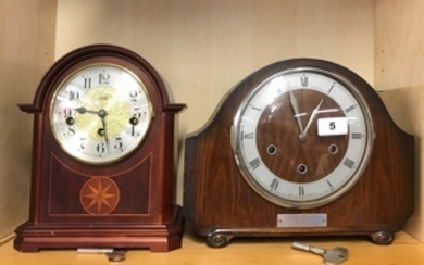 An inlaid Hermle mahogany mantle clock and a further mantle clock.