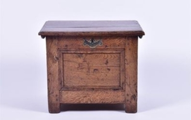 A late 17th century and later oak child's coffer with brass side handles and escutcheon, 52 cm x 37 cm x 42 cm.