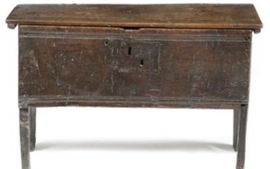 A small early 17th century oak boarded coffer, the…