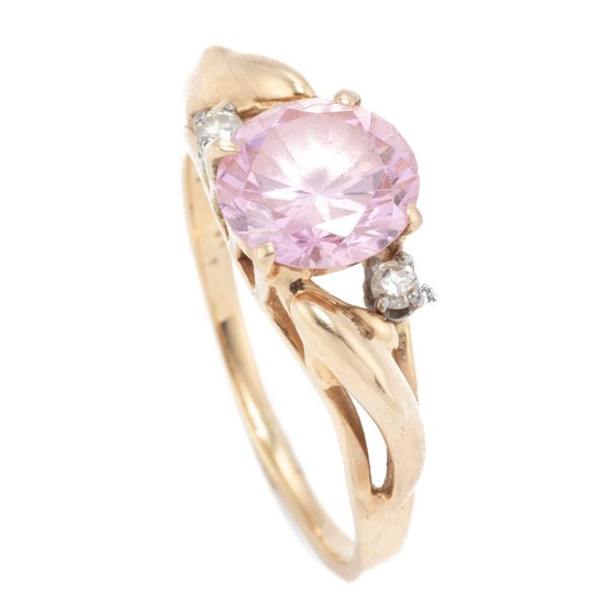 A 14CT GOLD ZIRCONIA AND DIAMOND RING; centring a round cut pink zirconia adjacent to 2 round brilliant cut diamonds, size N, wt. 3....