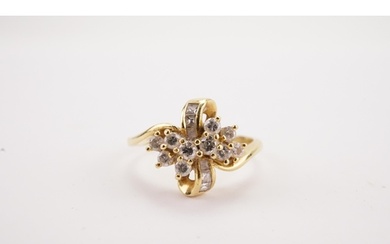 A 18ct gold diamond set bow designed ring, 11 brilliant cut ...
