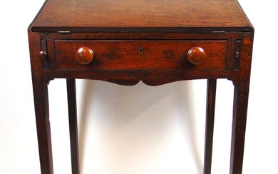 A 18th century oak clerk's desk, the fall front with...