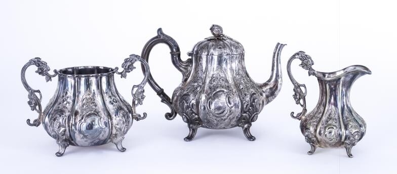 A 19th Century Indian Silvery Metal Three-piece Tea Service,...
