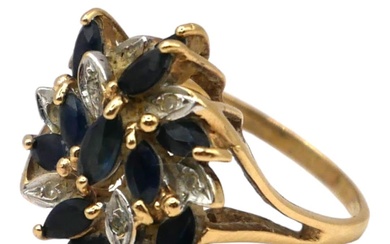 A 9CT GOLD, DIAMOND AND TOPAZ CLUSTER RING Having...