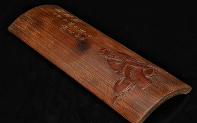 A BAMBOO ARM REST WITH CARVING
