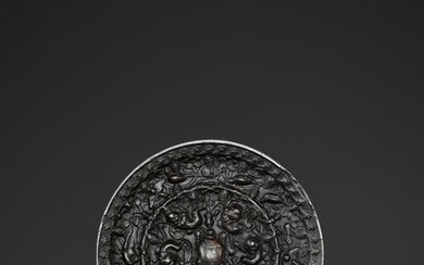 A BRONZE 'LION AND GRAPEVINE' MIRROR, TANG DYNASTY