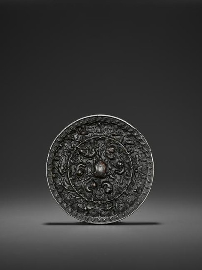 A BRONZE 'LION AND GRAPEVINE' MIRROR, TANG DYNASTY