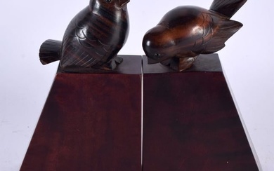 A CHARMING PAIR OF ART DECO CARVED ROSEWOOD AND FRUITWOOD FIGURES OF STYLISED BIRDS modelled upon si