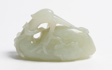 A CHINESE PALE CELADON JADE CARVING OF A RECUMBENT CRANE QING DYNASTY (1644-1912), CIRCA 18TH CENTURY