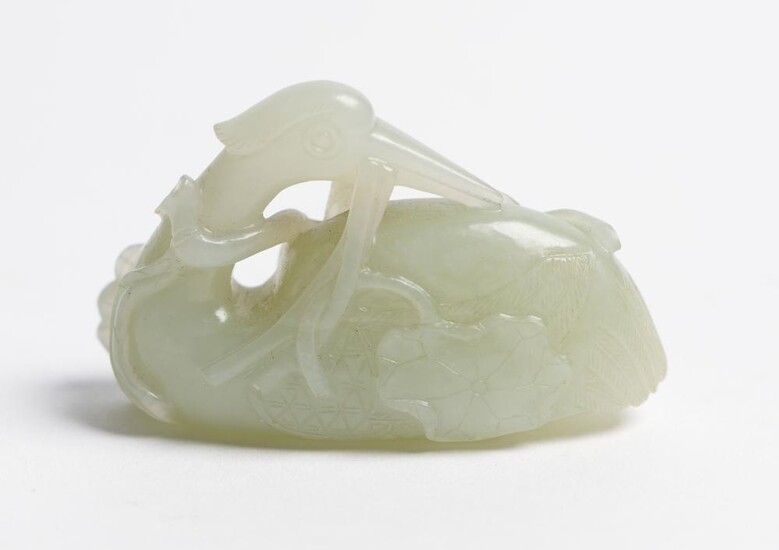 A CHINESE PALE CELADON JADE CARVING OF A RECUMBENT CRANE QING DYNASTY (1644-1912), CIRCA 18TH CENTURY