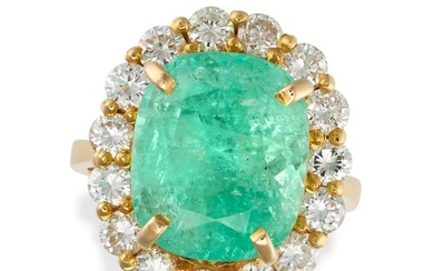 A COLOMBIAN EMERALD AND DIAMOND CLUSTER RING set with a cushion cut emerald of approximately 8.75