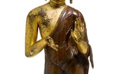 A COPPER ALLOY FIGURE OF A STANDING BUDDHA.