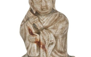 A Chinese Yaozhou celadon-glazed figure of a monk, Song dynasty, modelled seated with long flowing robes and a scroll in his right hand, 8.5cm high Provenance: Albert & Leonie van Daalen Collection; Ben Janssens Oriental Art, London, 3 April 2014.