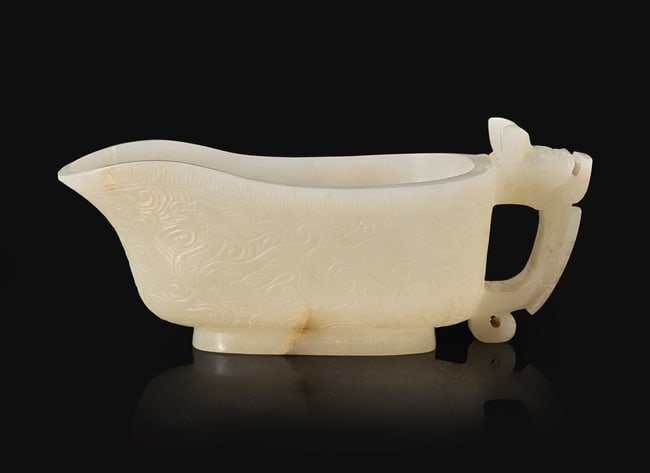 A Chinese carved white jade "Yi" water coupe, 18th/early 19th century or earlier 白玉