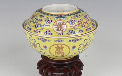A Chinese famille rose enamelled yellow ground porcelain bowl and matched cover, mark of Guangxu and
