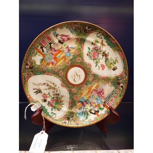 A Chinese famille rose plate with pictorial cartouches of sc...