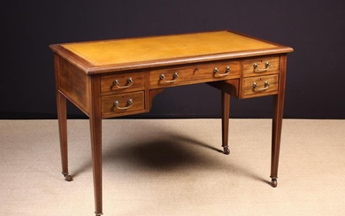 A Fine Edwardian Inlaid Mahogany Writing Table stamped with London maker's name Howard & Sons Ltd Be