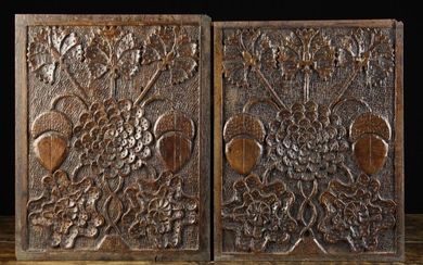 A Fine Pair of 17th Century Carved Oak Panels richly decorated with a stylised flower bloom of layer