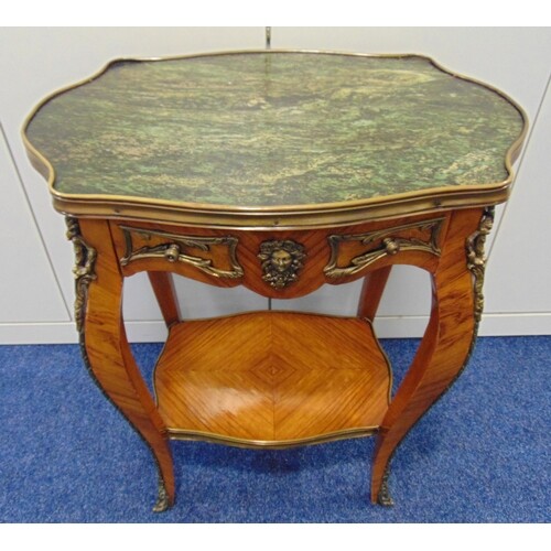 A French Kingswood side table, shaped oval with gilded metal...