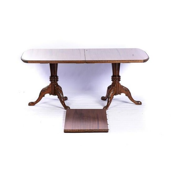 A GEORGE III STYLE MAHOGANY EXTENDING DINING TABLE