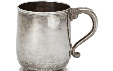 A George I Britannia standard silver mug, London, 1716, maker's mark rubbed, of slightly tapering form with scroll handle and circular foot, 9cm high, approx. weight 6.9oz