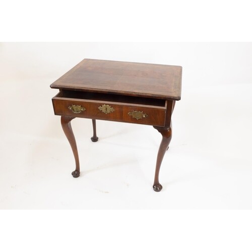 A George II Irish Walnut Side Table. Circa 1740. Fitted with...