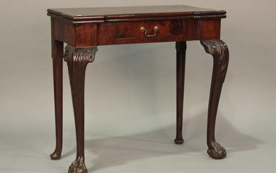 A George II mahogany fold-over card table, the hinged top with projecting corners above a single fri