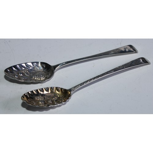 A George III silver berry spoon, embossed bowl, engraved flo...