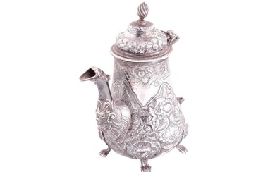A George III silver coffee pot by William Cripps, London 1776, of pear form, decorated with