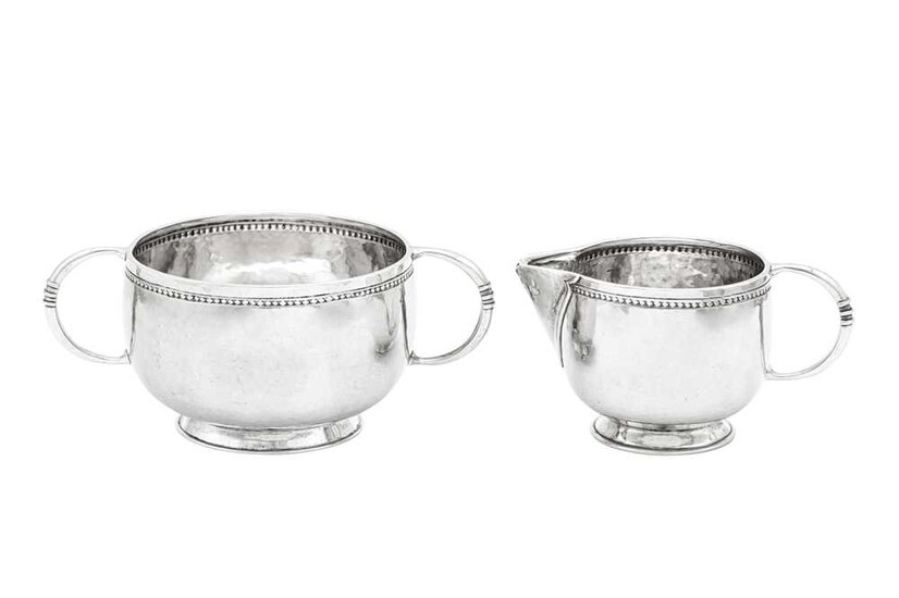 A George V ‘Arts and Crafts’ sterling silver strawberry set, Birmingham 1912 by Liberty and Co