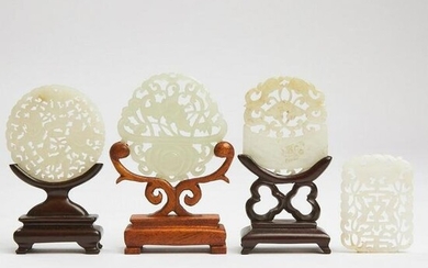 A Group of Four Carved and Pierced White Jade Plaques