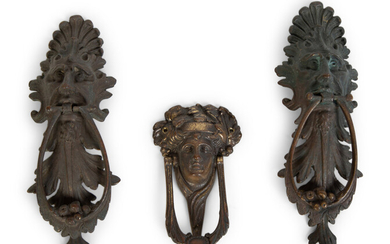 A Group of Three Continental Patinated Metal Door Knockers