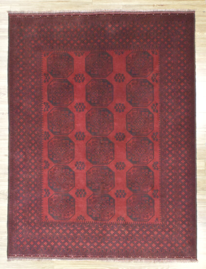 A HANDKNOTTED PURE WOOL AFGHAN KUNDUS RUG