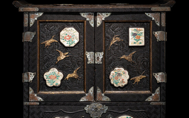 A Japanese Porcelain and Metal Inset Wood Chest