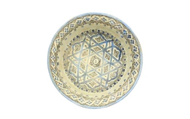 A KASHAN COBALT BLUE AND BLACK-PAINTED POTTERY BOWL WITH SIX-POINTED STAR DESIGN Kashan, Iran, late 12th - 13th century