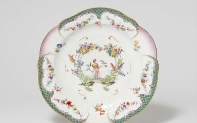 A Meissen porcelain plate from a dinner service with a green mosaic border