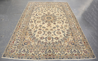 A Nain carpet, Central Persia, late 20th century, the cream field with a flowerhead medallion and pa