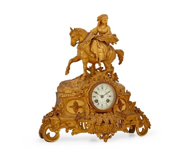 A Napoleon III gilt-bronze and metal figural mantel clock